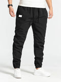 Men's Drawstring Patch Ankle-tied Tapered Trousers